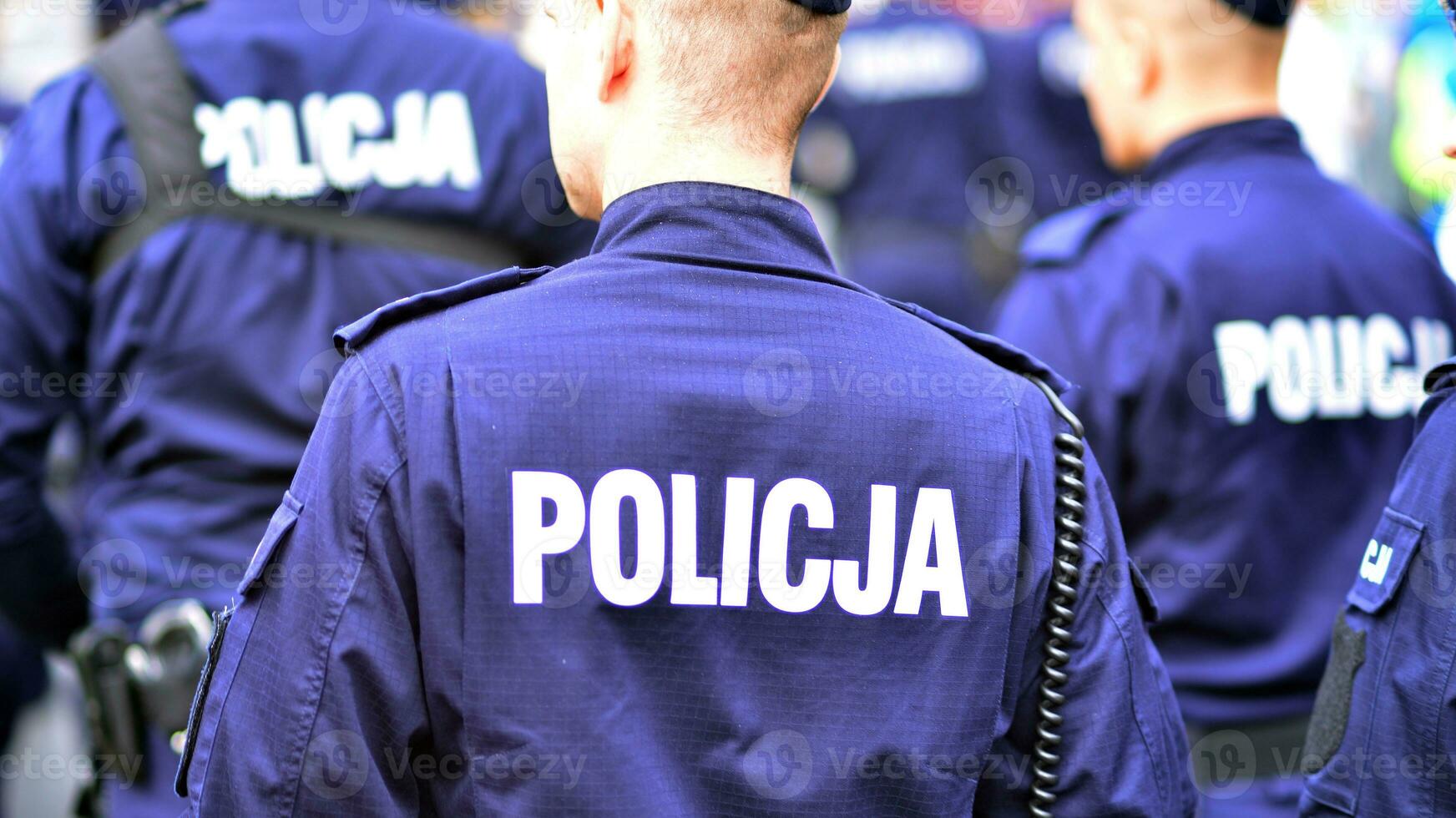 Police sign - logo on the back of the police uniform. Policja. photo