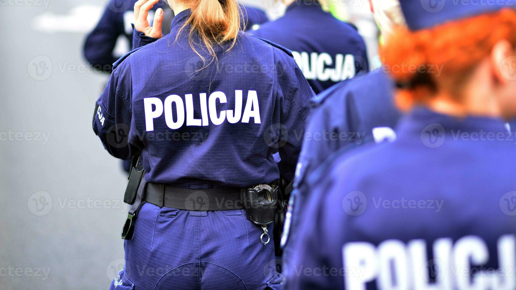 Police sign - logo on the back of the police uniform. Policja. photo