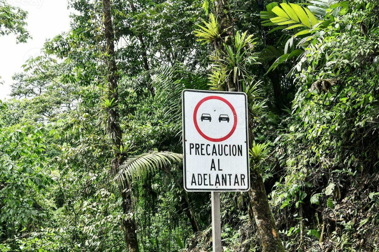 a sign that says precaucion al adelantar photo