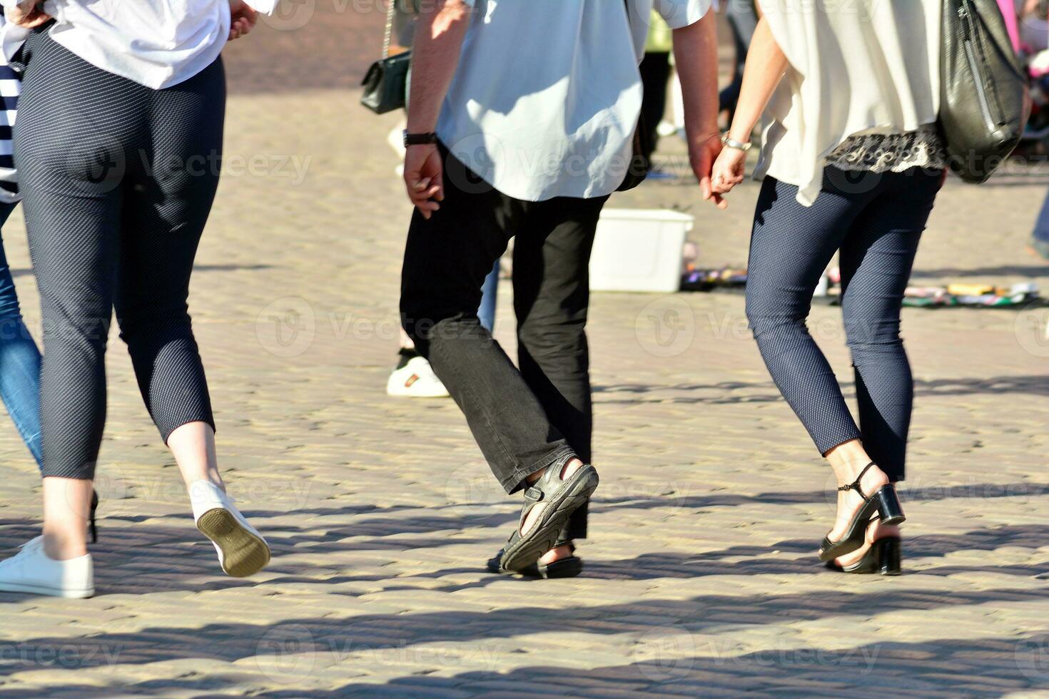 People walking on big city street, blurred motion crossing abstract photo