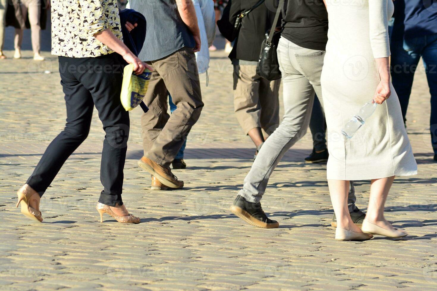 People walking on big city street, blurred motion crossing abstract photo