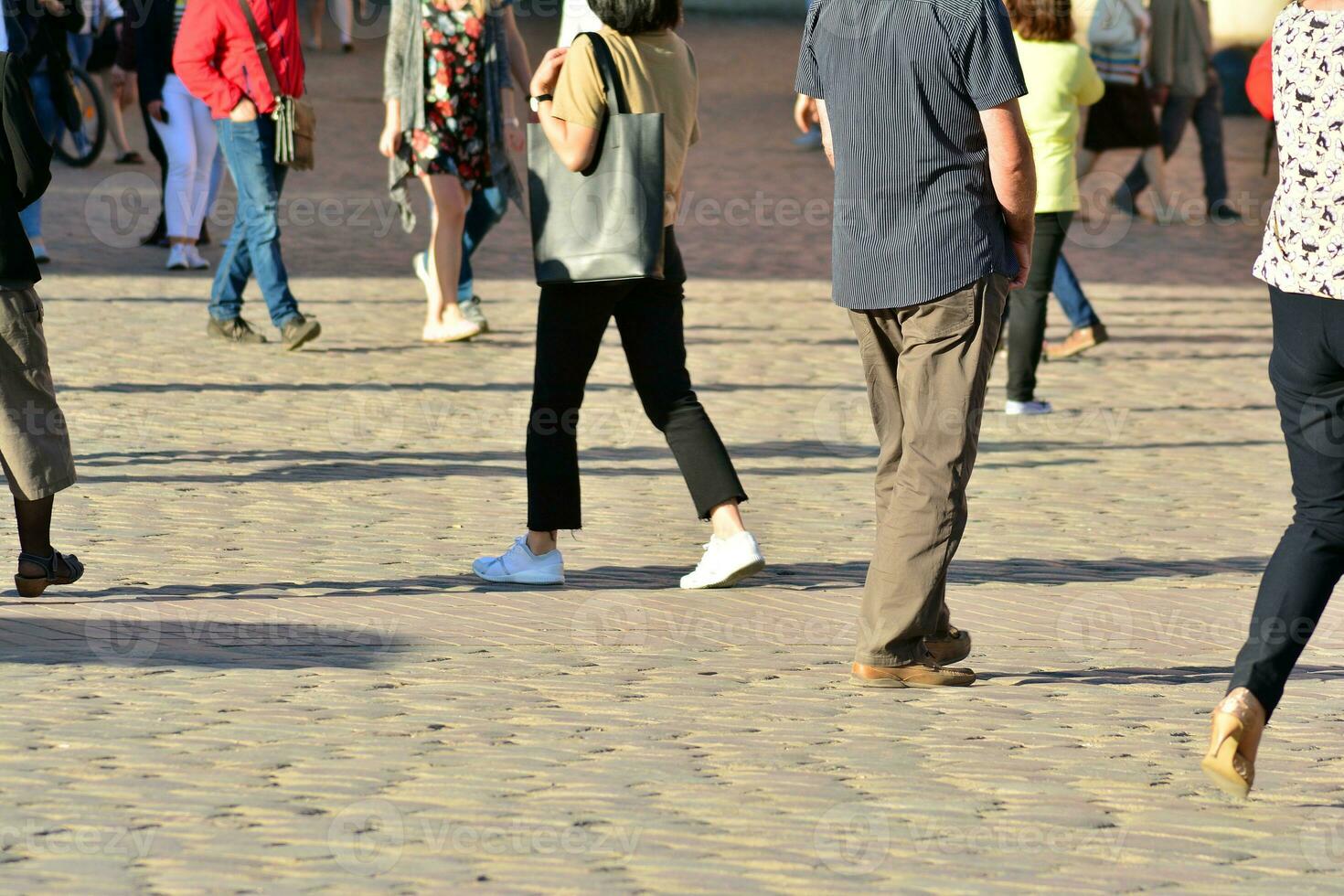 People walking on big city street, blurred motion crossing abstract photo
