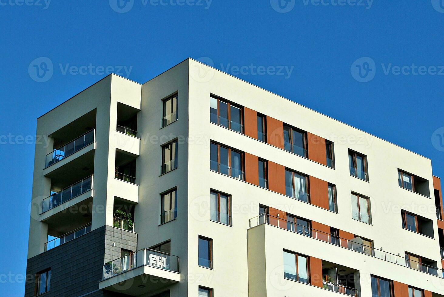 Modern apartment building in sunny day. Exterior, residential house facade. photo