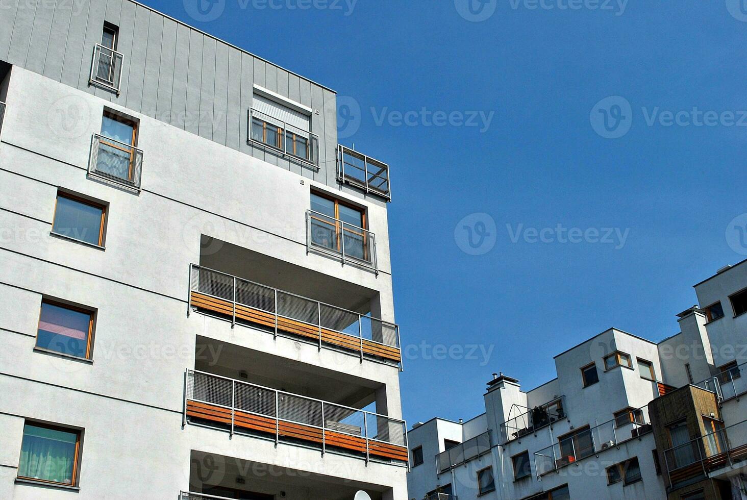 Modern apartment building in sunny day. Exterior, residential house facade. photo