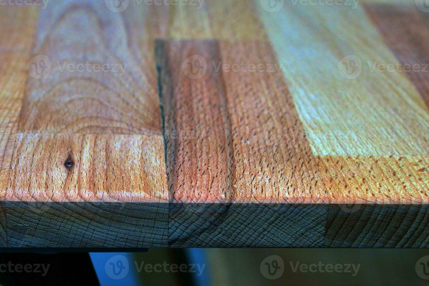 Wooden dinner table surface. Natural wood furniture close view photo