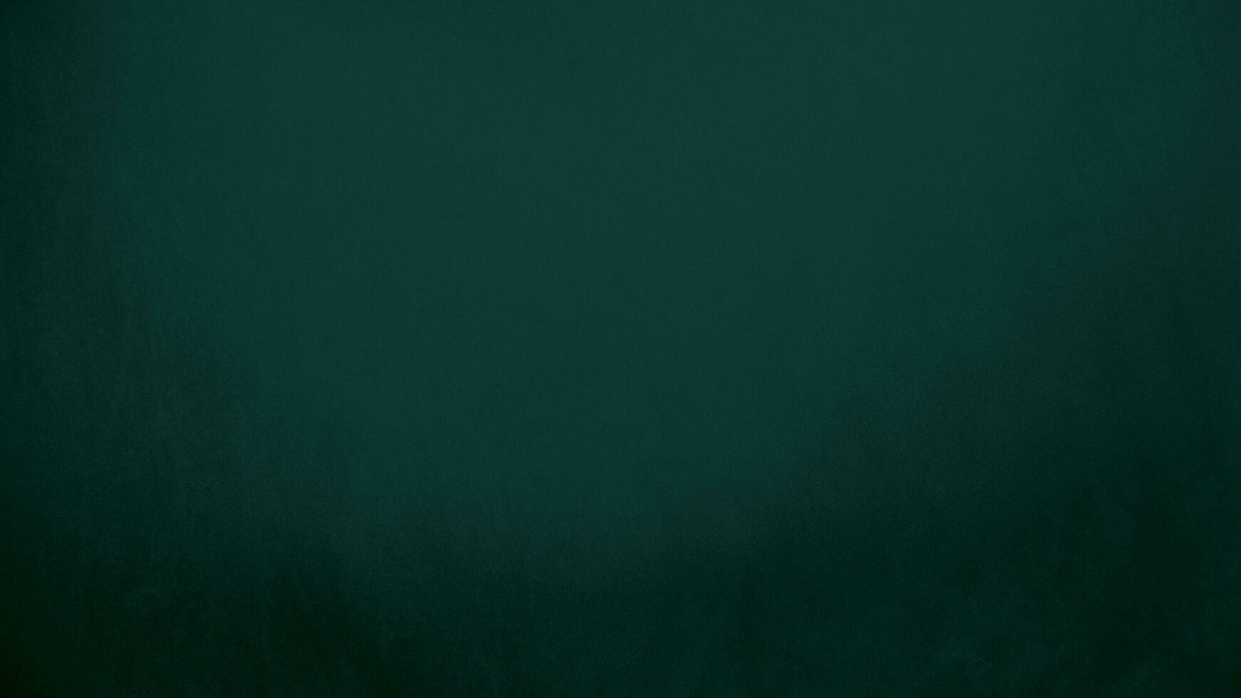 Green velvet fabric texture used as background. Emerald color panne fabric background of soft and smooth textile material. crushed velvet .luxury emerald tone for silk.. photo