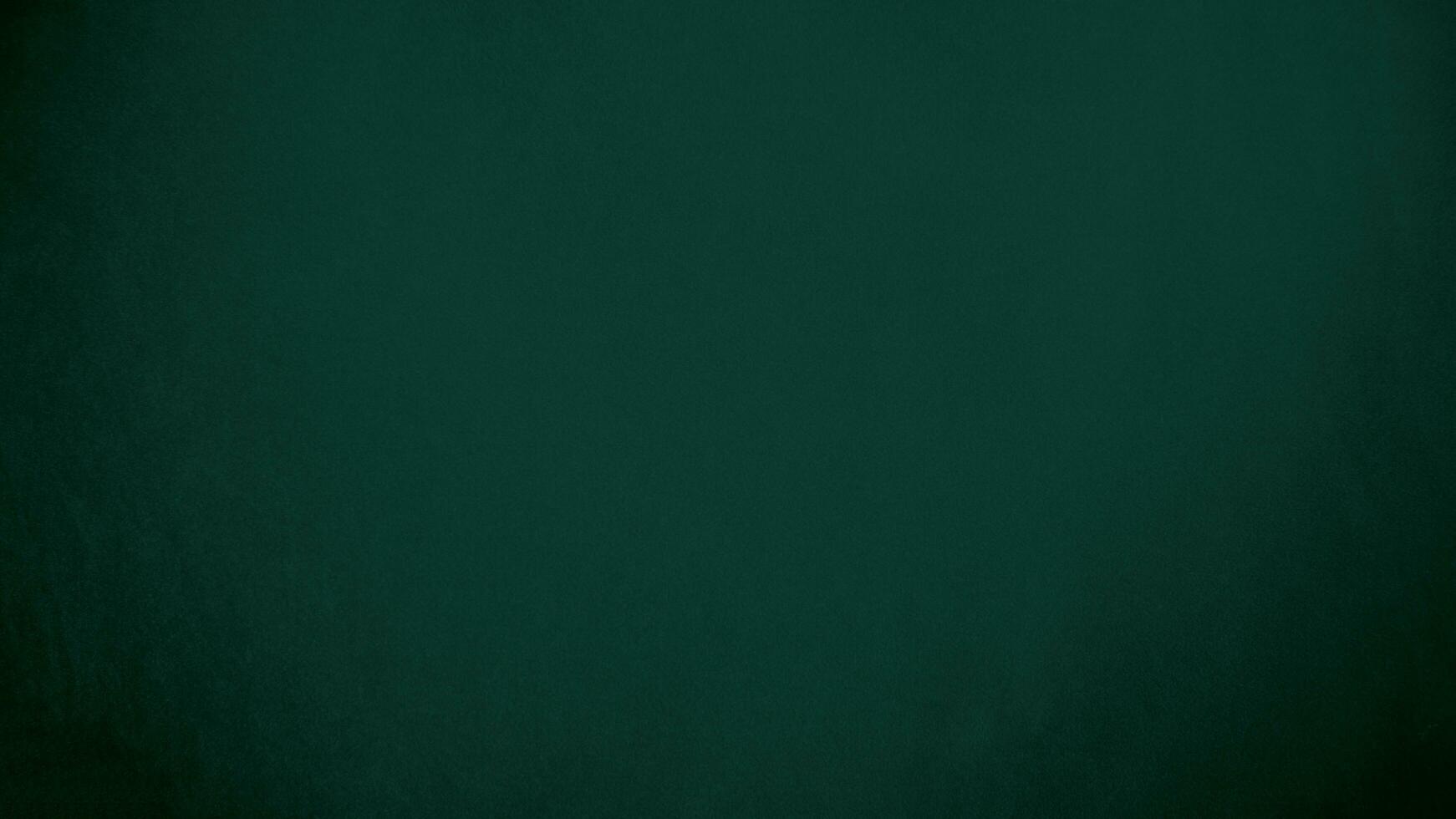 Green velvet fabric texture used as background. Emerald color panne fabric background of soft and smooth textile material. crushed velvet .luxury emerald tone for silk.. photo