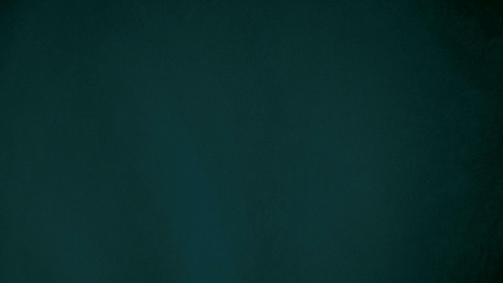 Green velvet fabric texture used as background. Emerald color panne fabric background of soft and smooth textile material. crushed velvet .luxury emerald tone for silk.. photo