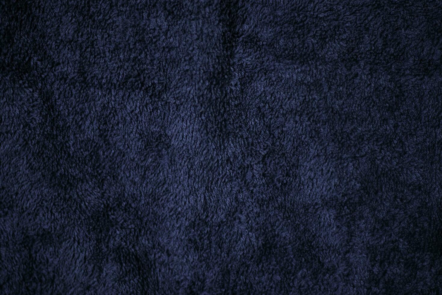 Dark blue velvet fabric texture used as background. Sky color panne fabric background of soft and smooth textile material. crushed velvet .luxury cobalt tone for silk. photo