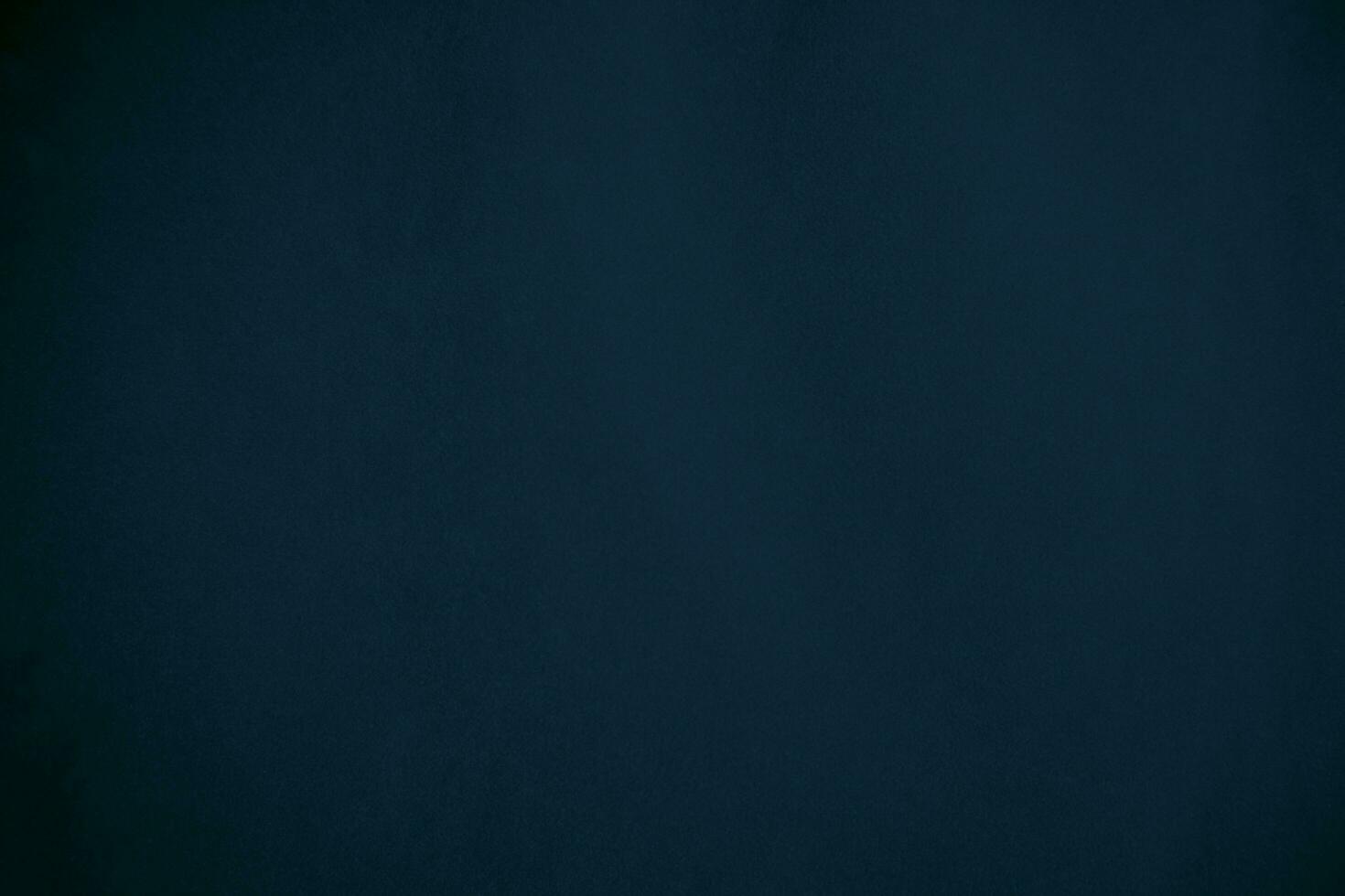 blue velvet  soft rough textile material background texture close up,poker table,tennis ball,table cloth. Empty navy blue fabric denim background. photo