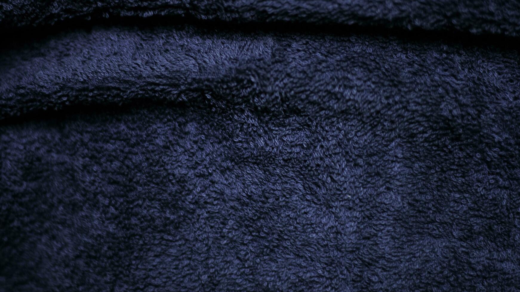 oscuro azul terciopelo tela textura usado como antecedentes. cielo color pana tela antecedentes de suave y suave textil material. aplastada terciopelo .lujo cobalto tono para seda. foto