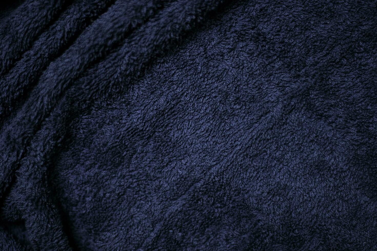 Dark blue velvet fabric texture used as background. Sky color panne fabric background of soft and smooth textile material. crushed velvet .luxury cobalt tone for silk. photo