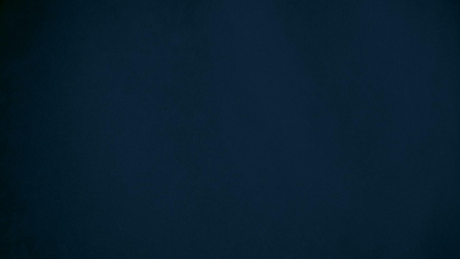 blue velvet  soft rough textile material background texture close up,poker table,tennis ball,table cloth. Empty navy blue fabric denim background. photo