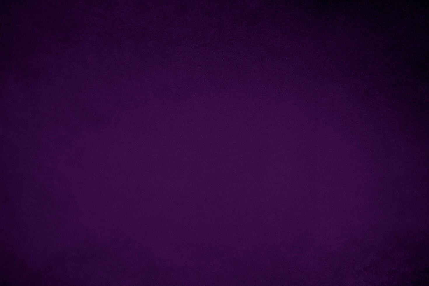 Dark purple velvet fabric texture used as background. Violet color panne fabric background of soft and smooth textile material. crushed velvet .luxury magenta tone for silk. photo