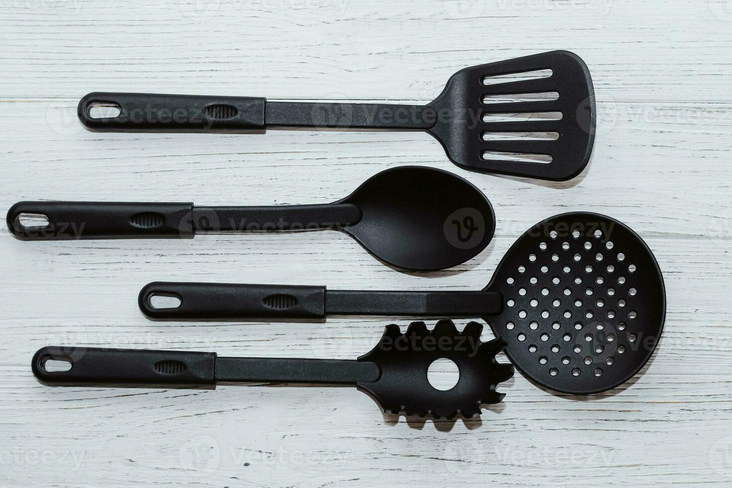 Kitchen tools plastic for multicooker on a wooden table photo
