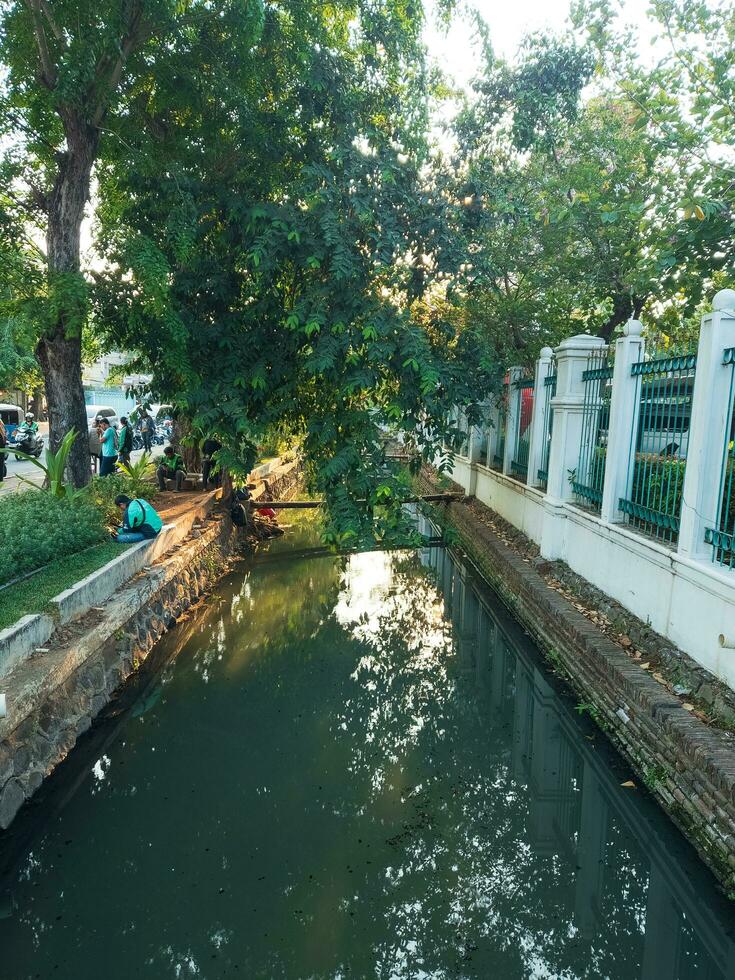 Dirty river in Jakarta, the capital city of Indonesia photo