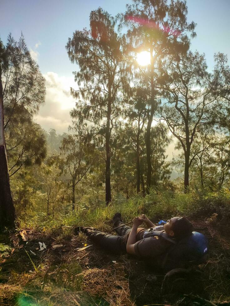 Batu, Indonesia. 7-05-2023. young people climbing the mountain, One of the best views when climbing Mount Bhutak. photo