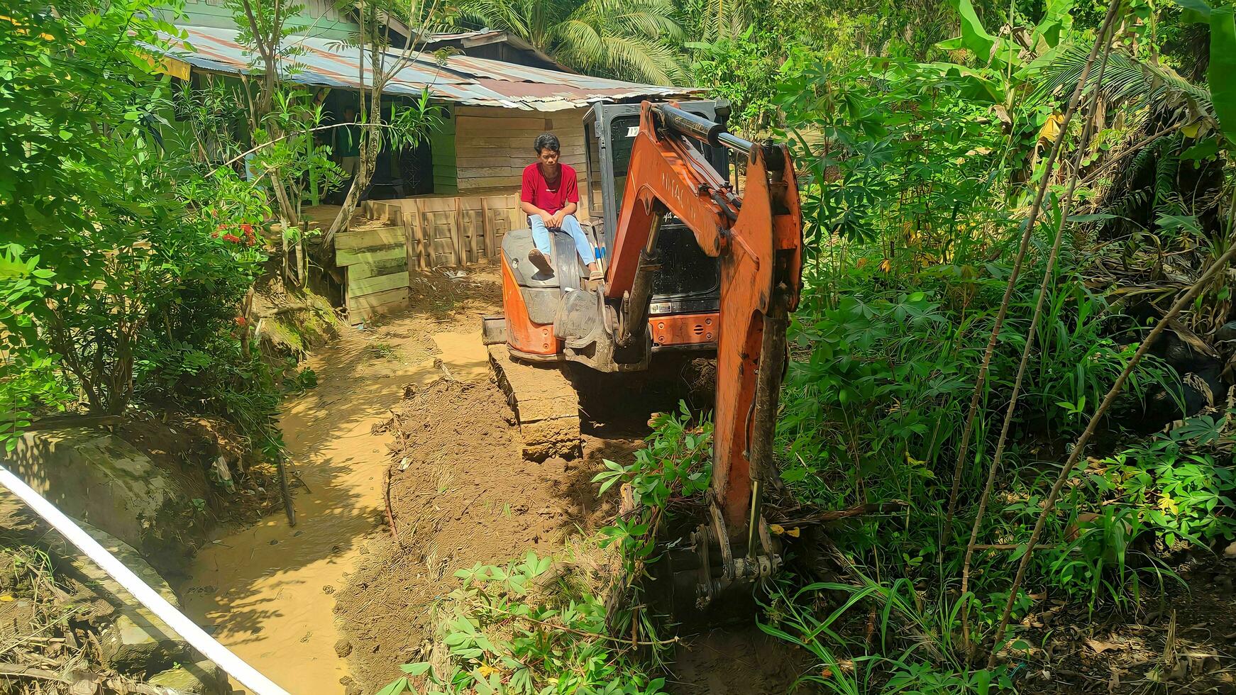 Kuaro Kalimantan Timur, Indonesia 29 November 2023. Excavator heavy equipment is digging irrigation canals photo