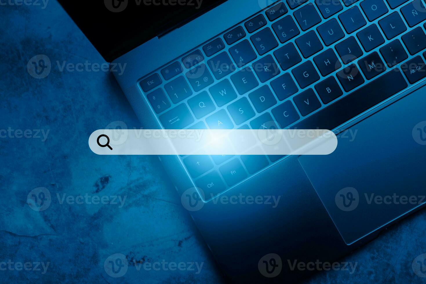 Laptop keyboard top view with VR search bar. SEO. Browser technology. Concept of searching on internet with copy space. photo