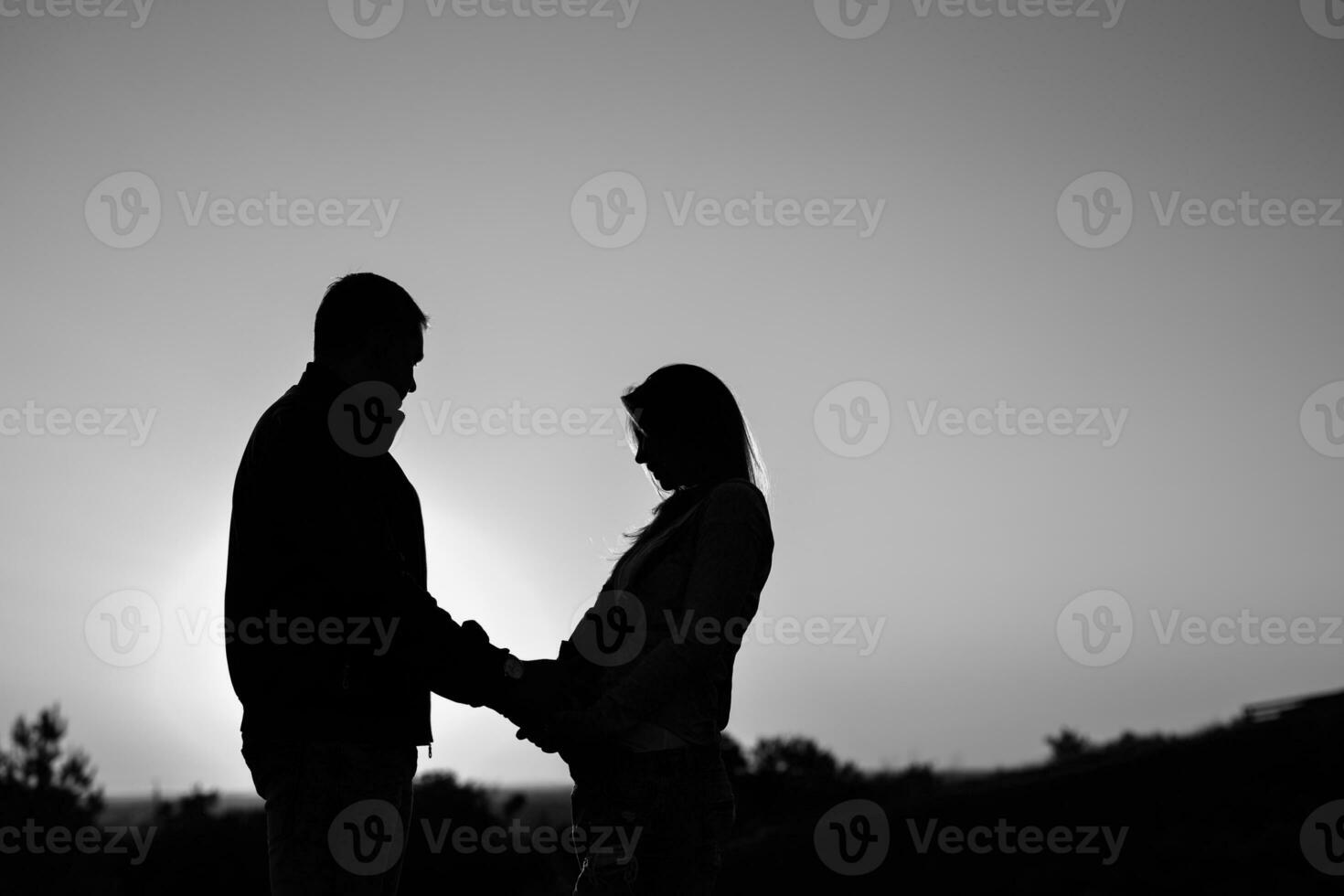 Pregnant couple silhouettes photo