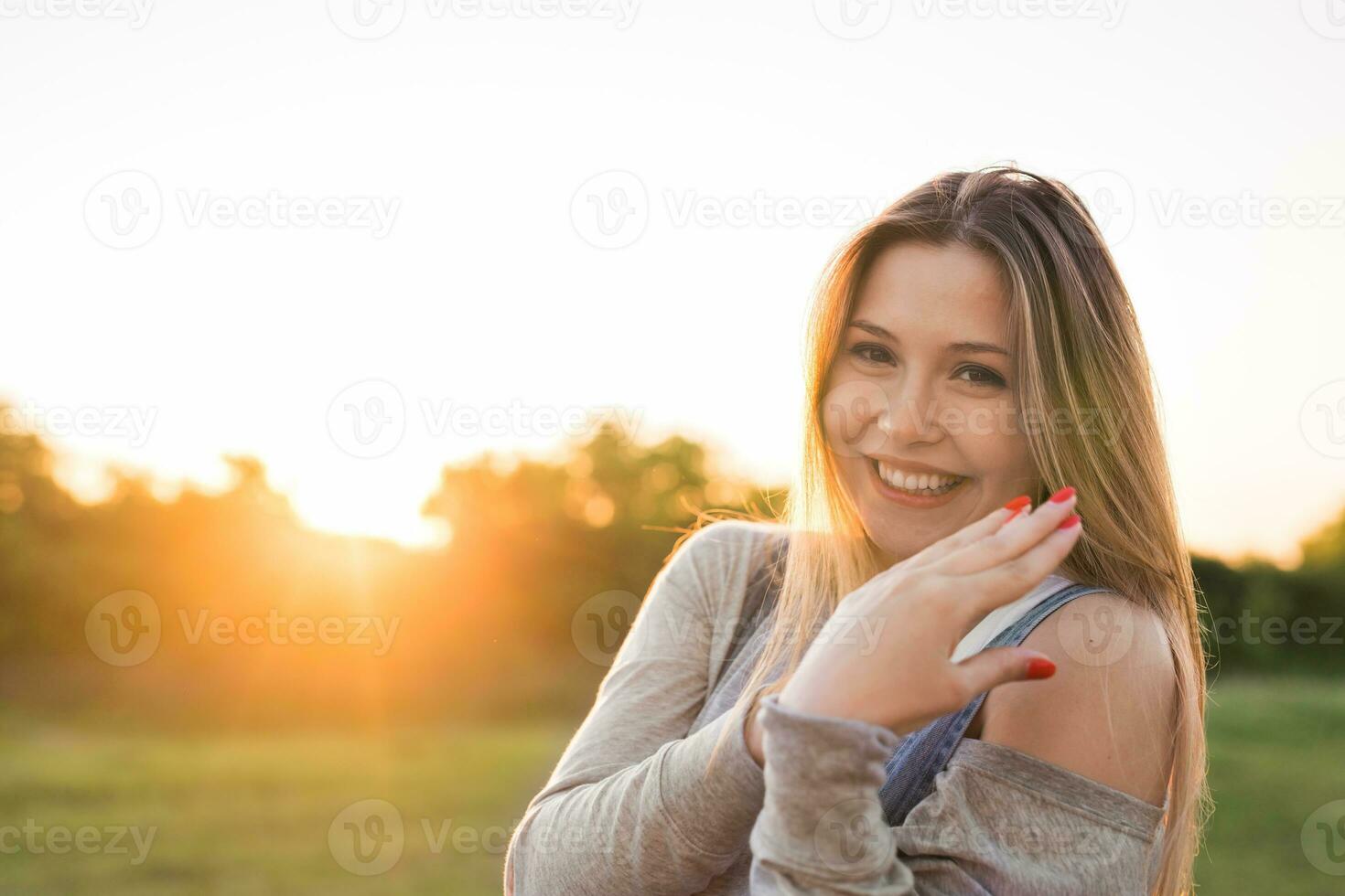 beautiful portrait of carefree friendly approachable girl with a stunning smile and cute looks photo