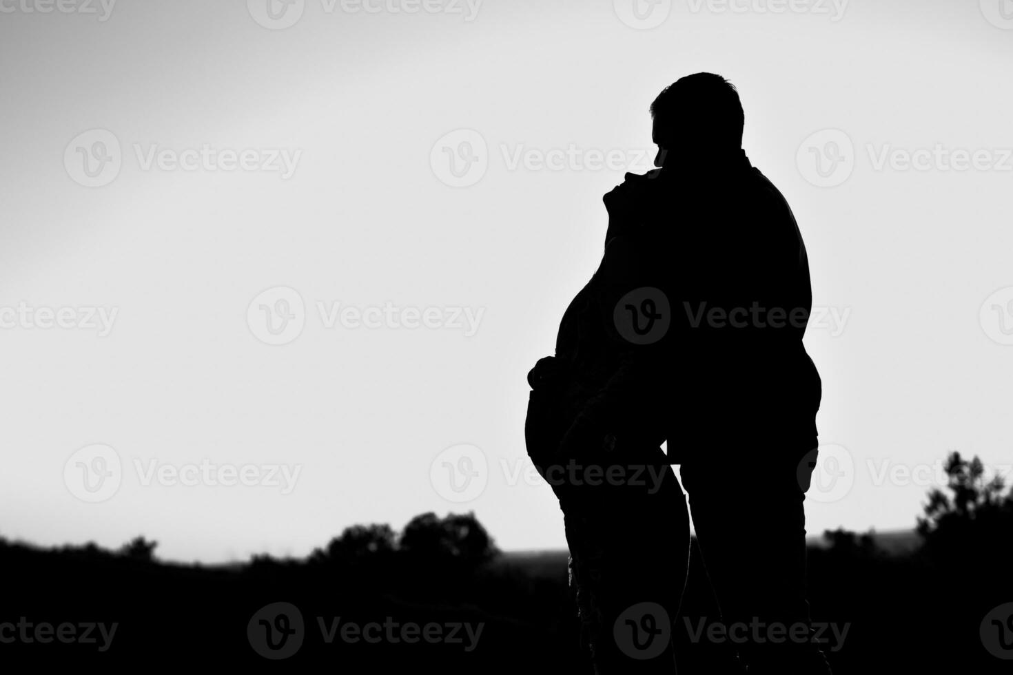 Pregnant couple silhouettes photo