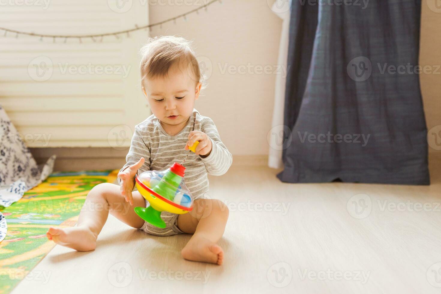 funny boy kid playing with toy photo