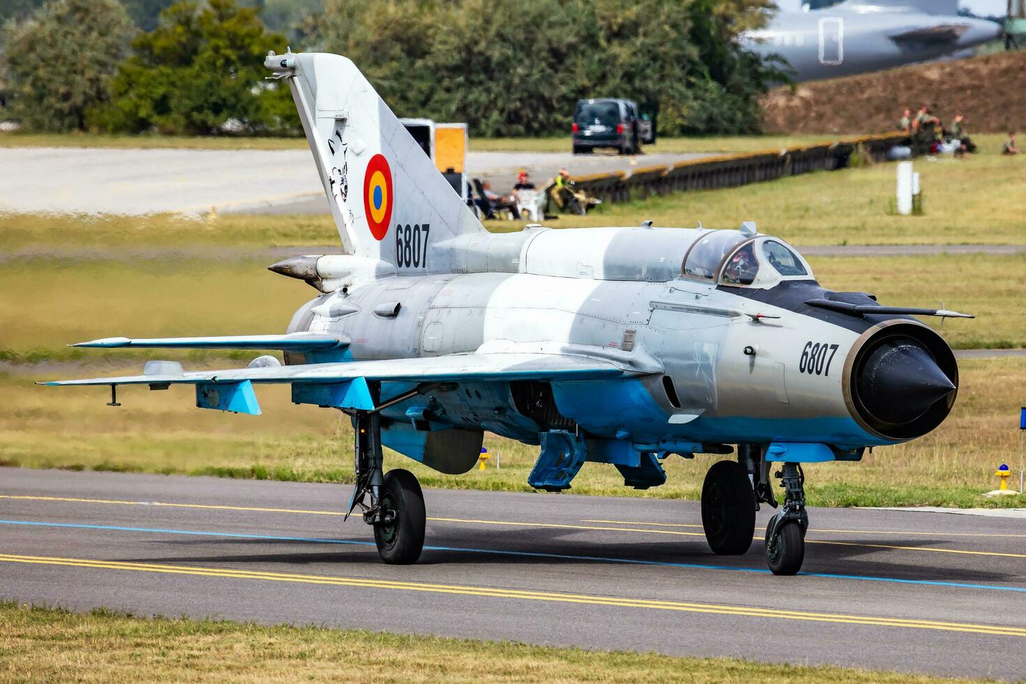 Kecskemet, Hungary, 2021 - MiG-21 military fighter jet plane at air base. Air force flight operation. Aviation and aircraft. Air defense. Military industry. Fly and flying. photo