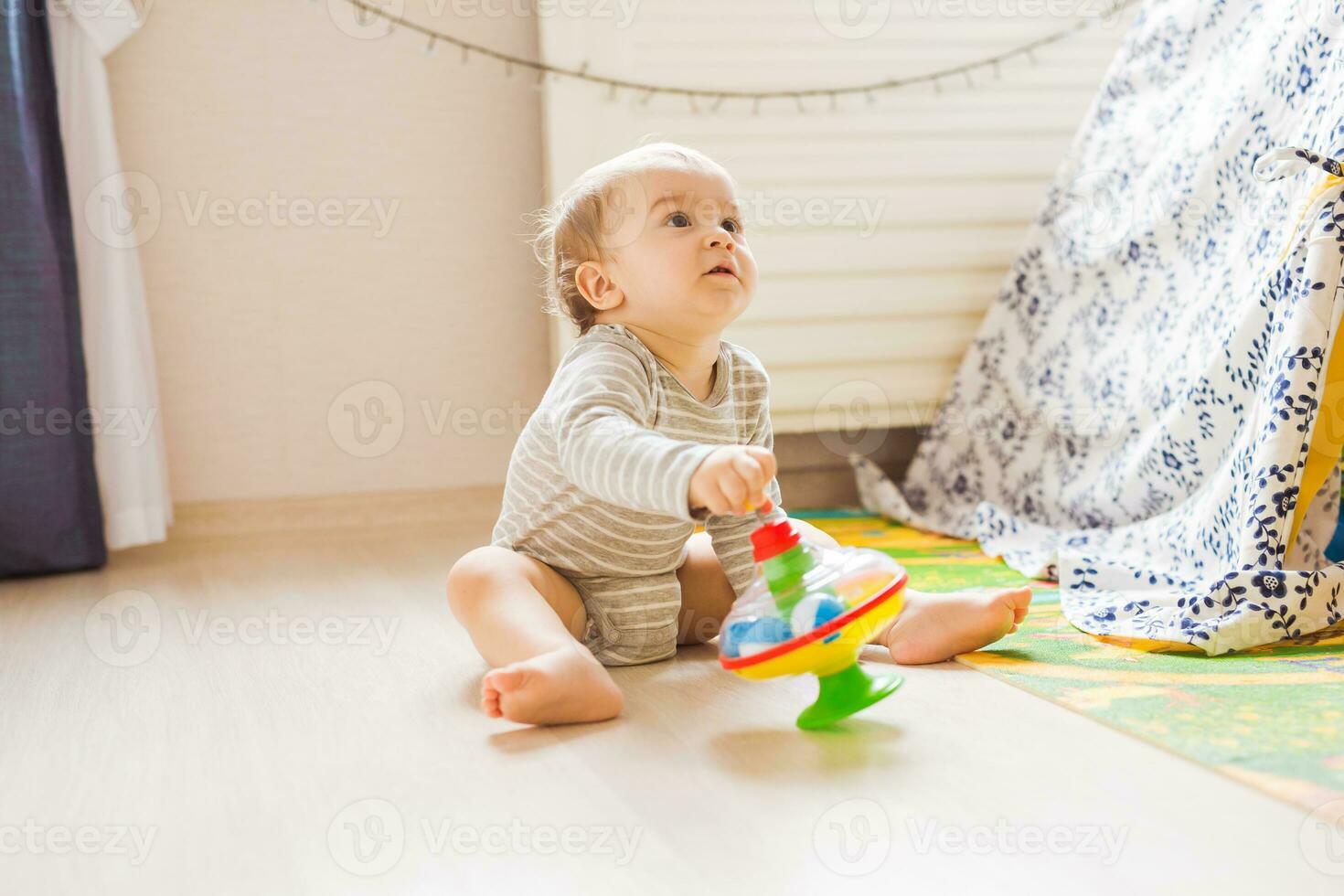 funny boy kid playing with toy photo