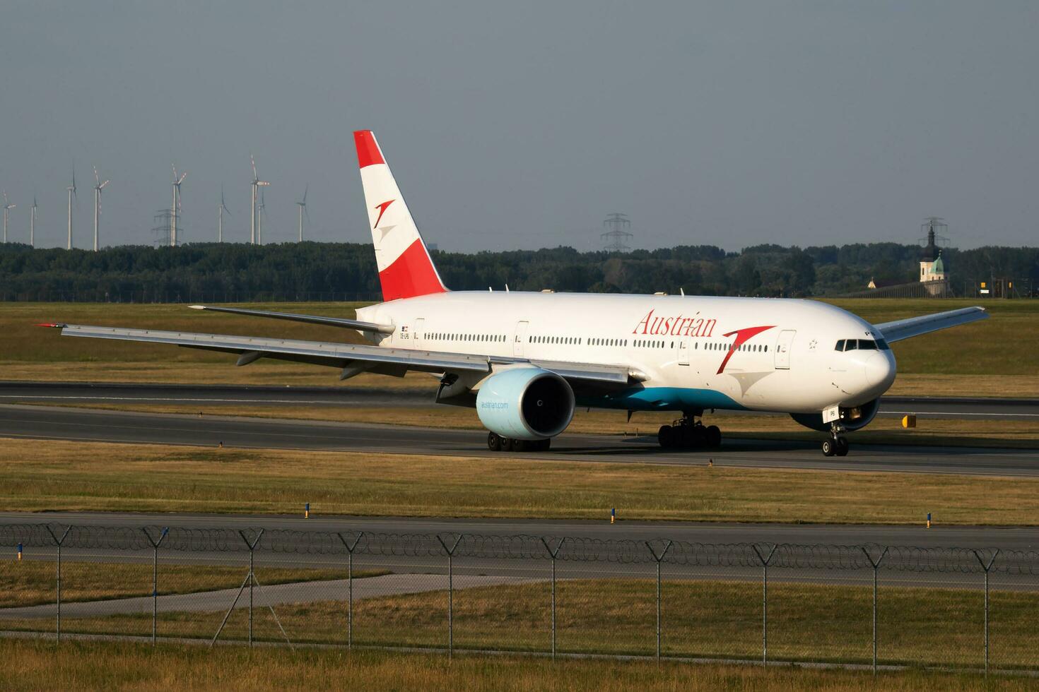 Vienna, Austria, 2018 - Austrian Airlines Boeing 777-200 OE-LPB passenger plane arrival and landing at Vienna Airport photo