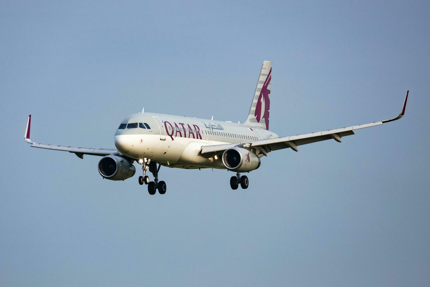 Budapest, Hungary, 2023 - Qatar Airways Airbus A320 passenger plane at airport. Aviation and aircraft. Air transport and travel. Fly and flying. photo