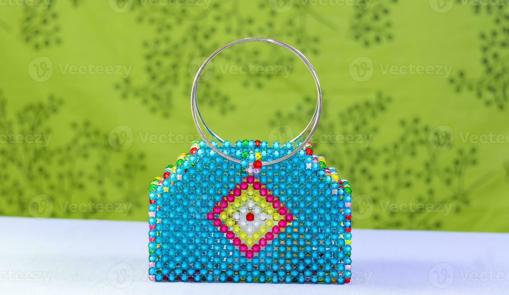 Colorful hand bag made of beads. Beaded bag for ladies. photo