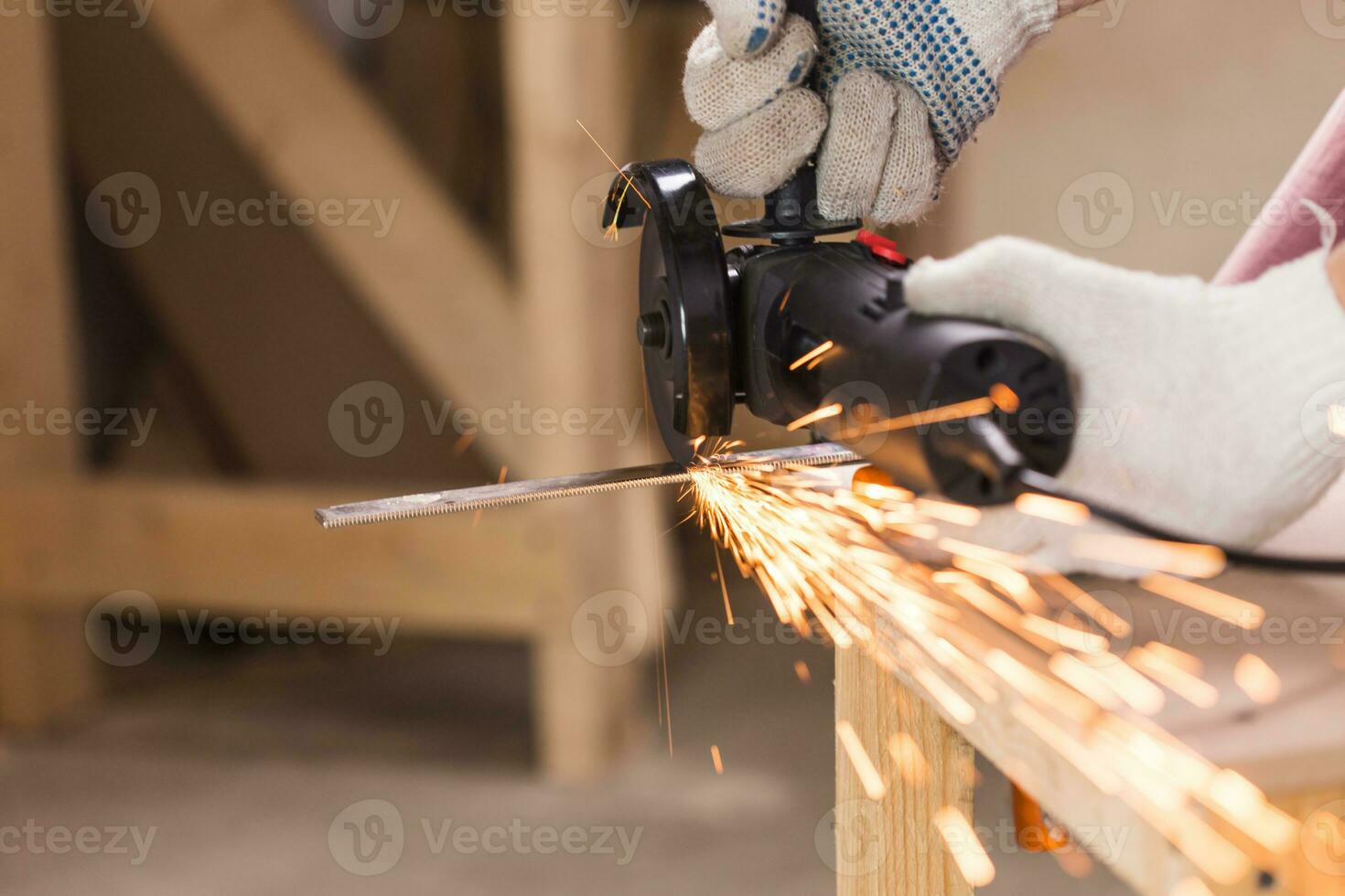 cutting metal with angle grinder, sparks from the disk. photo