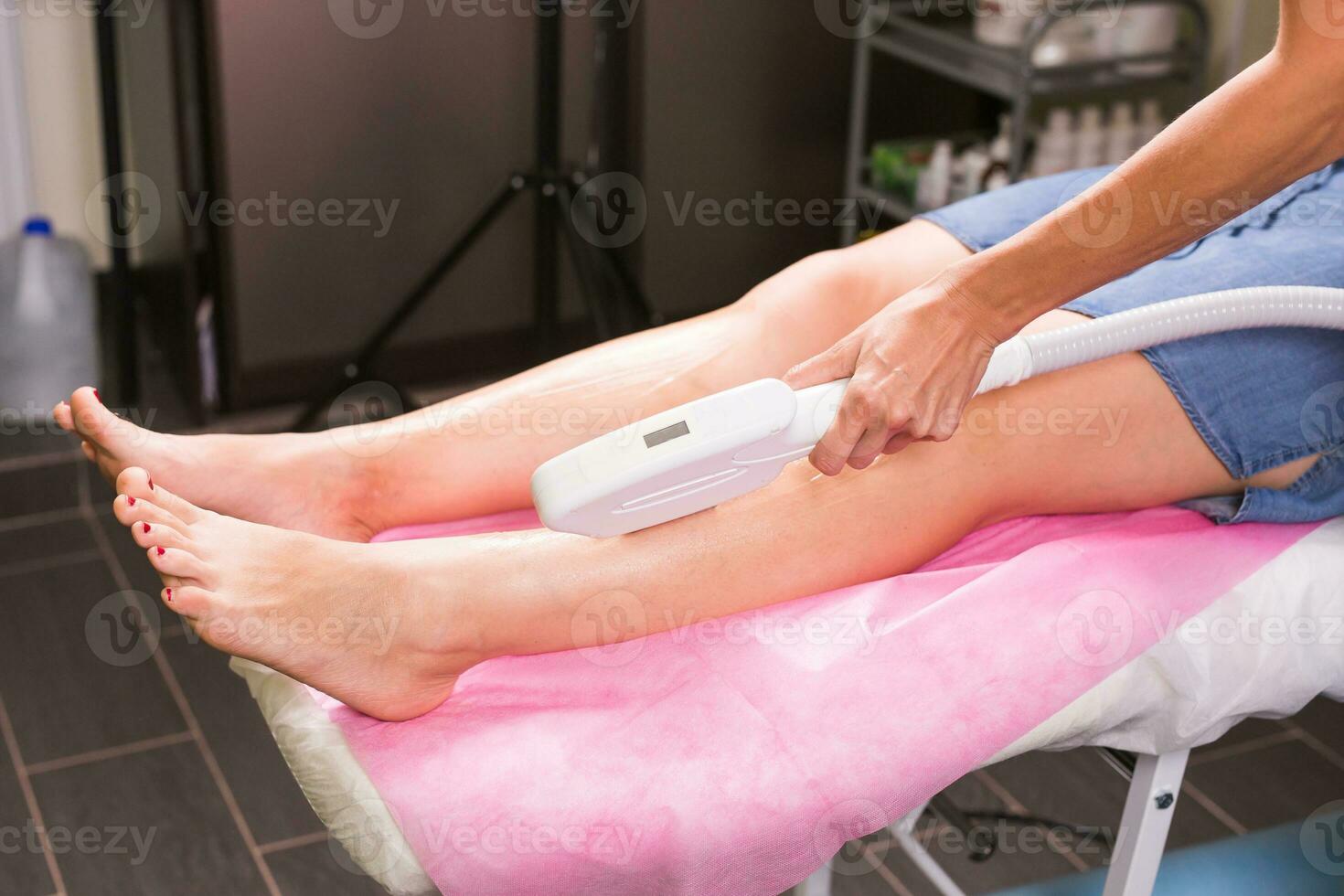 Laser epilation. Hair removal procedure. Cosmetology and SPA concept. photo