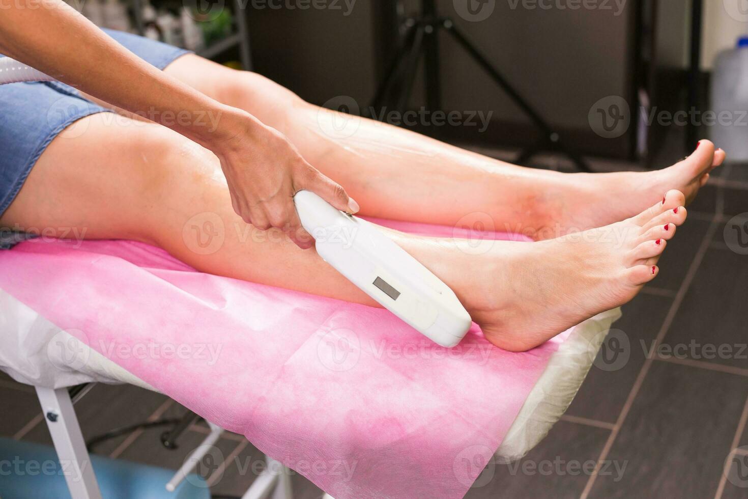 Laser epilation. Hair removal procedure. Cosmetology and SPA concept. photo