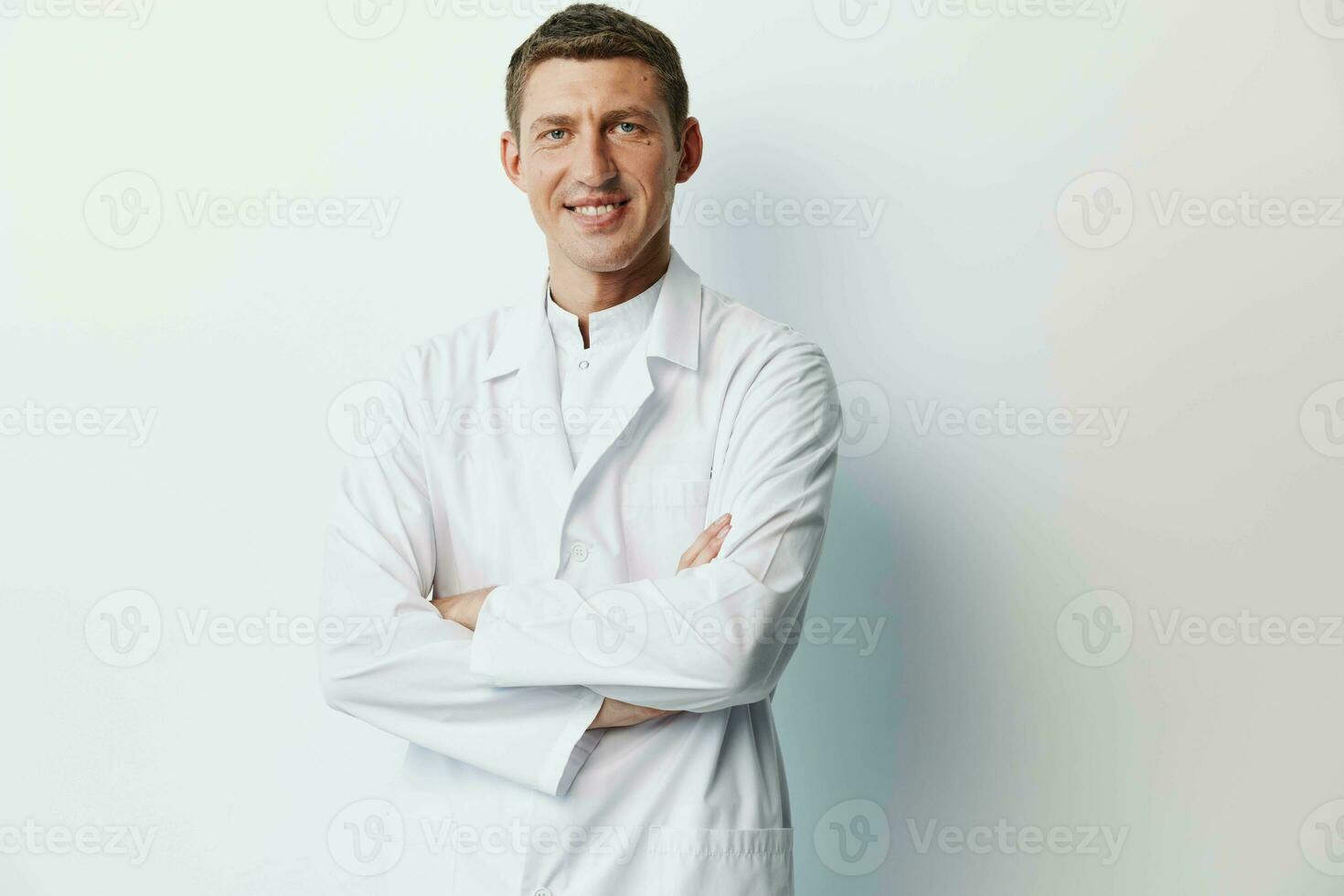 Man clinic medic adult white young person portrait stethoscope coat professional smile doctor photo