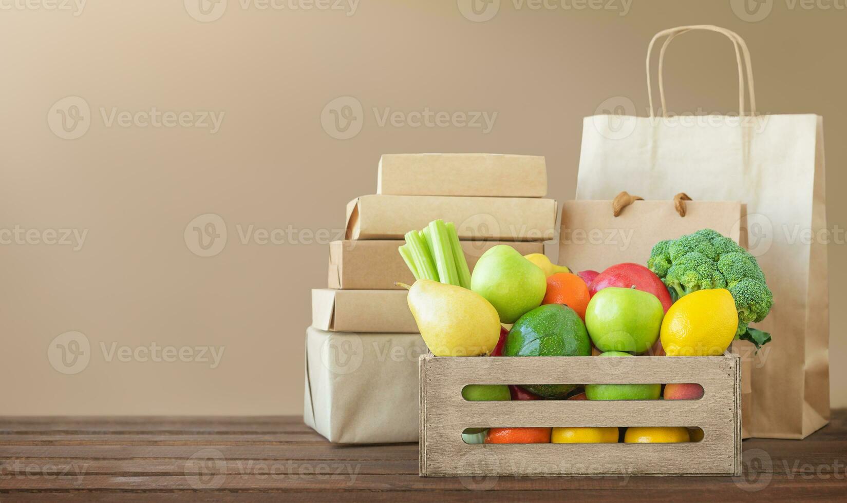 Box with food and paper packaging. Delivery concept. photo