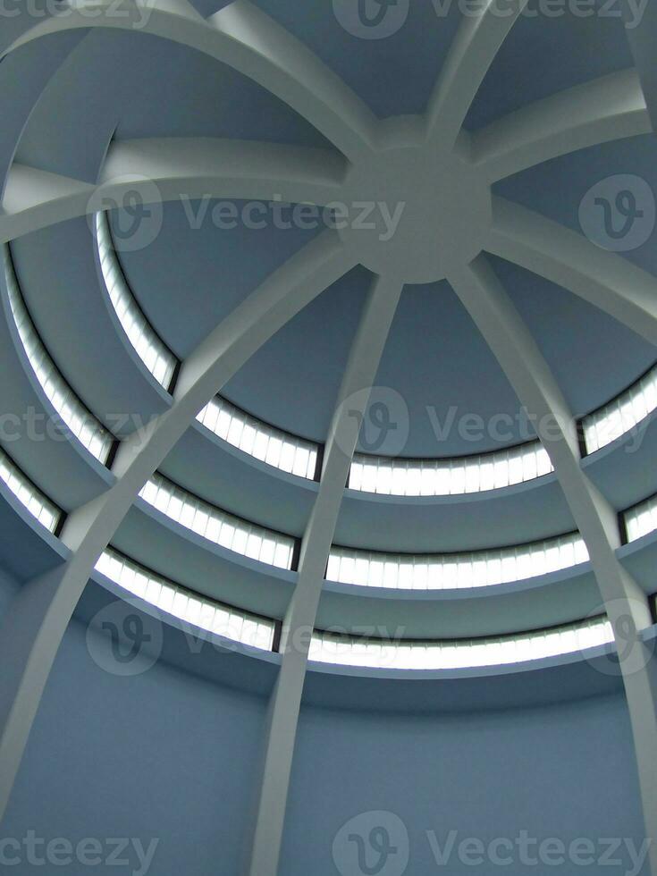 a circular ceiling with a circular window photo