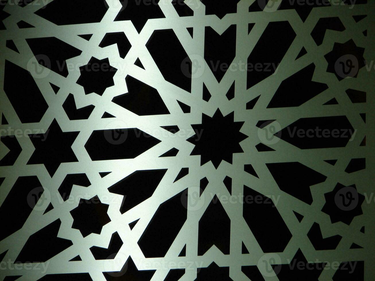 a decorative metal screen with a star pattern photo