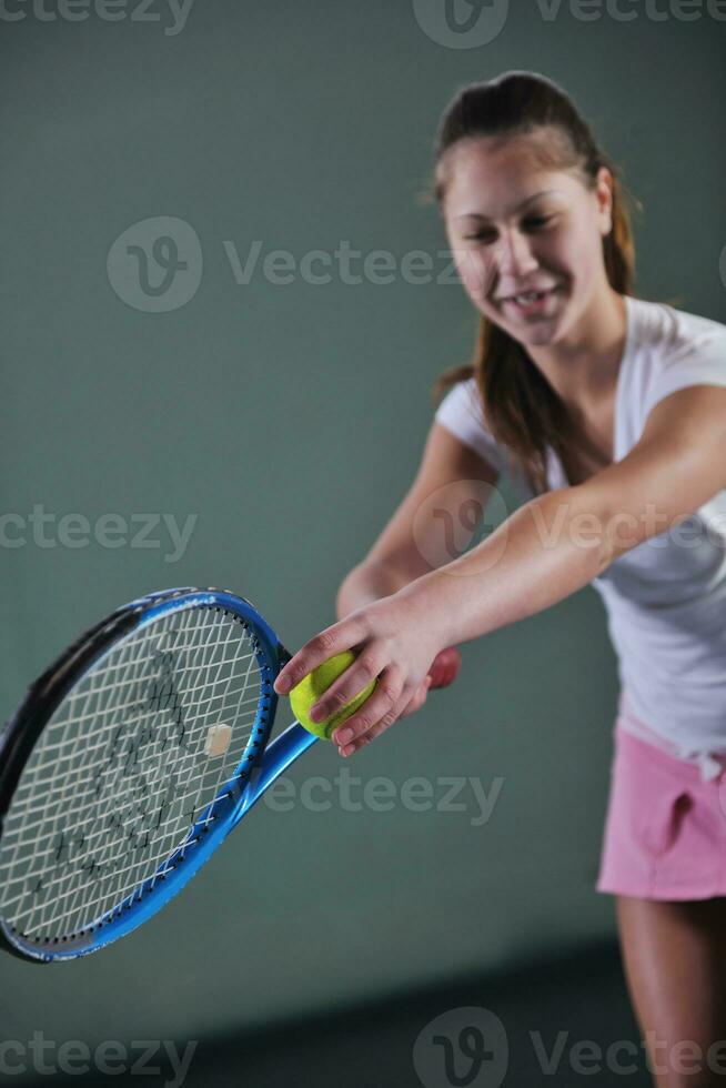 Girl playing tennis photo