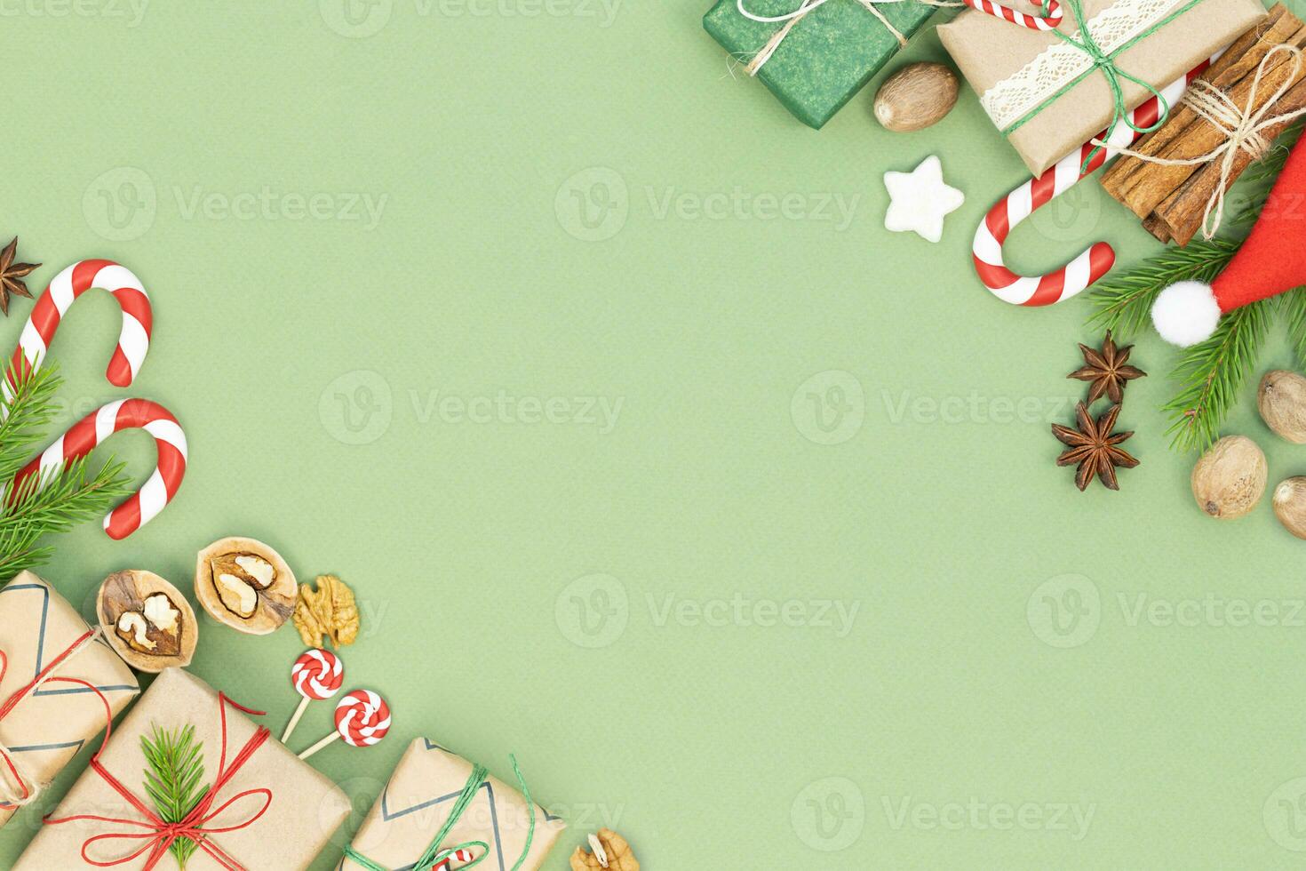 Christmas background with gift boxes, candy canes and spices photo