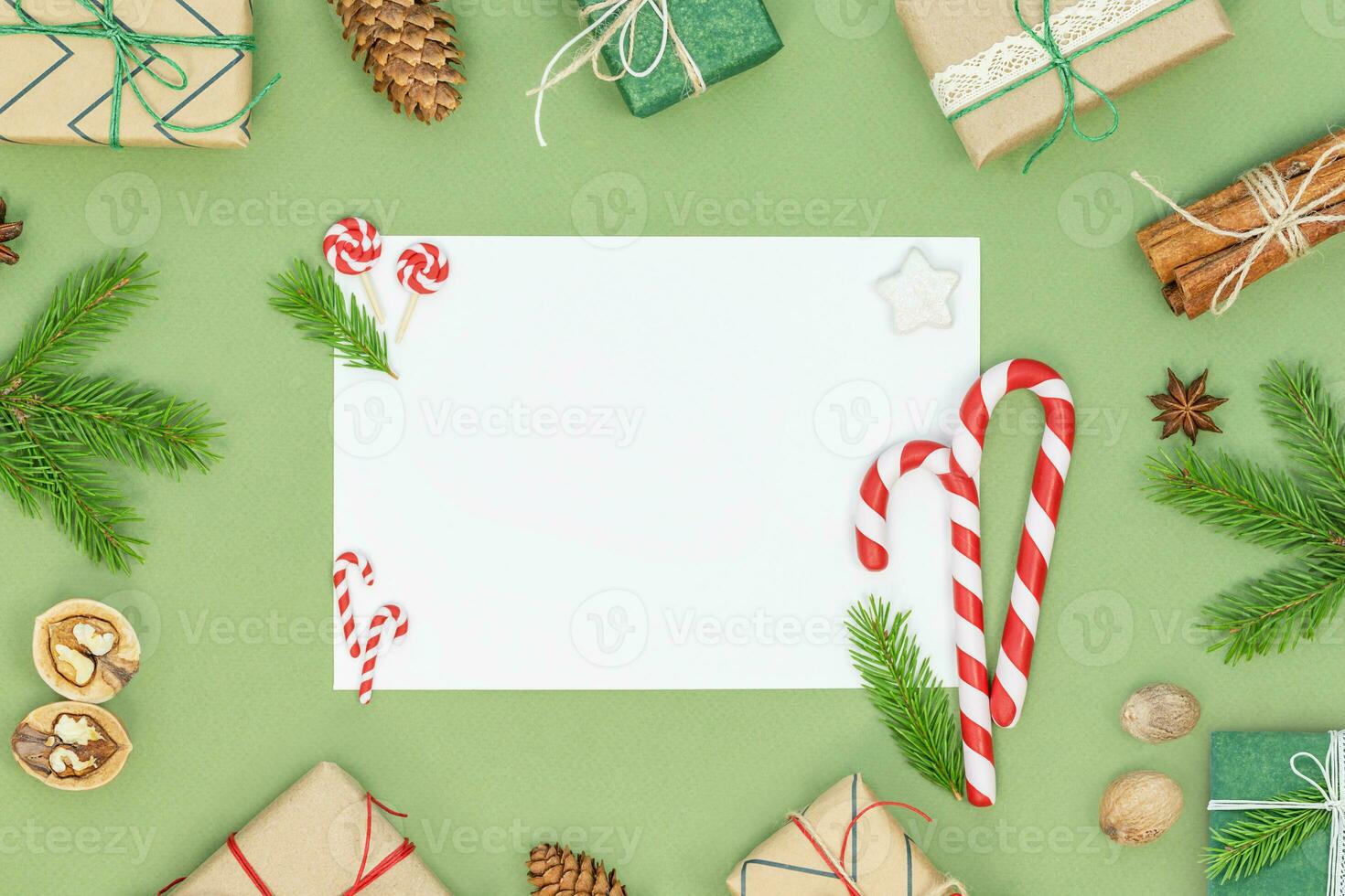 Christmas background with gift boxes, candy canes, spices and copy space photo