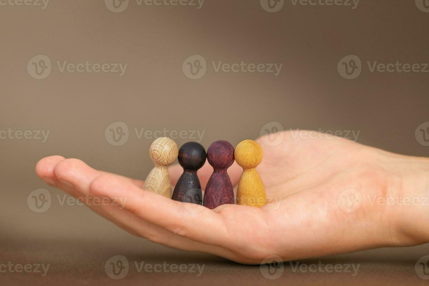 Supporting Concepts. Four figures in hand. photo