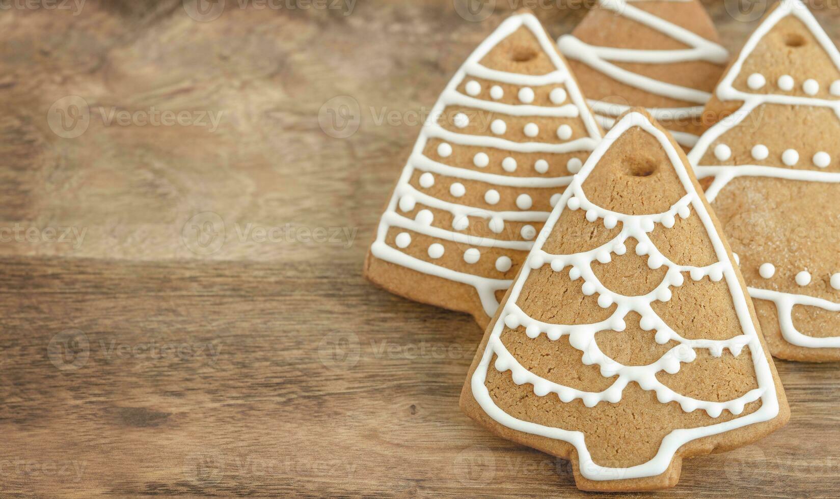 Holiday gingerbread cookies on the wooden background photo