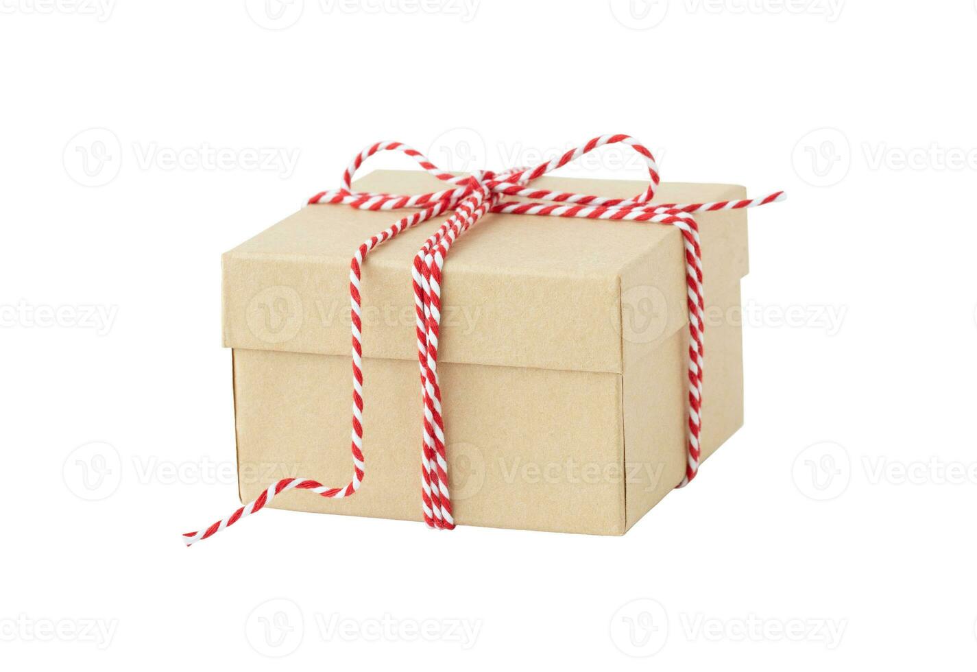 Isolated holiday box with red ribbon photo