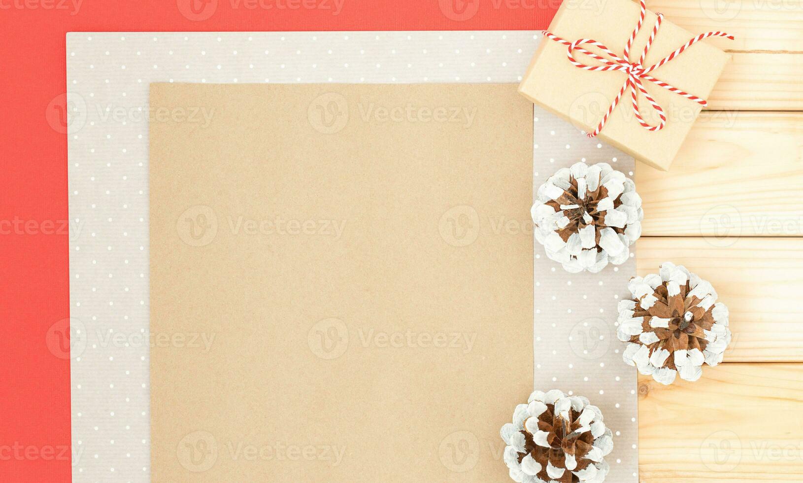 Christmas background with sheets of paper, cones and gift photo