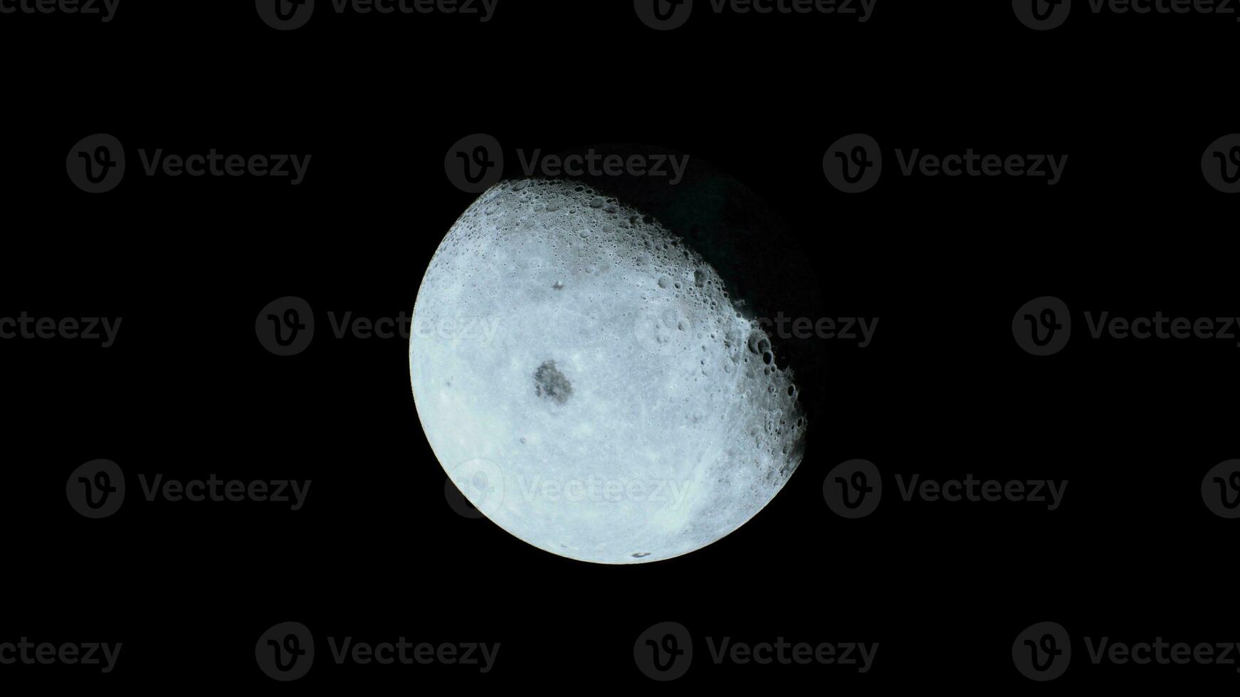 perspective of the partially illuminated lunar surface seen from afar photo