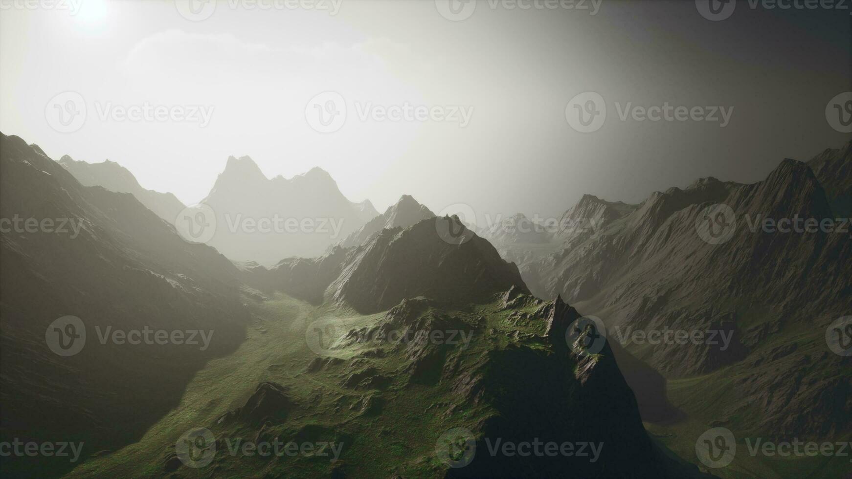 Misty mountain range covered in fog photo