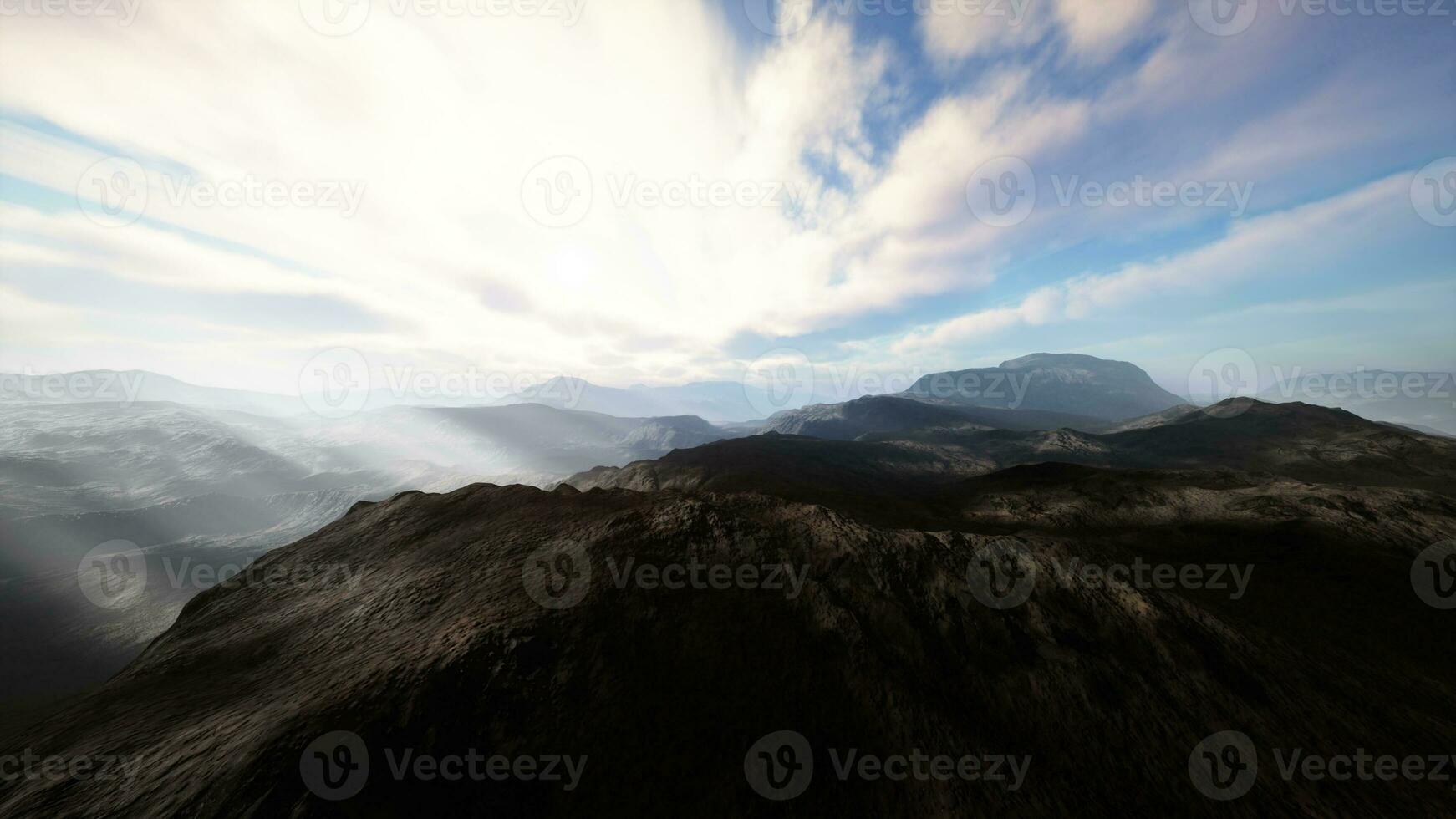 Alpine chains shrouded in the morning fog photo