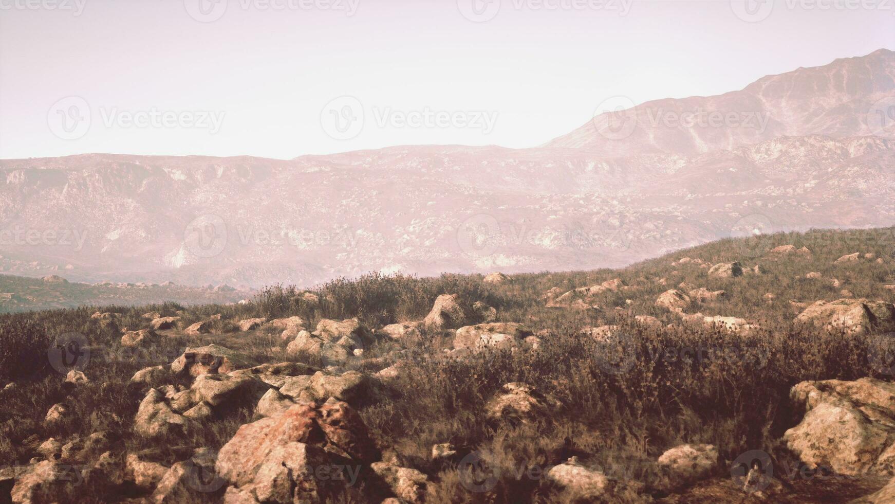 highland plateau between rocky mountains in the misty daybreak photo